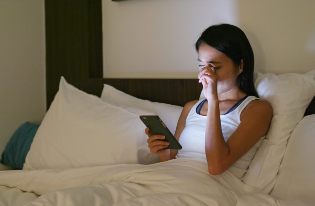 Women having hard time sleeping at night due to too much usage of phone before sleeping